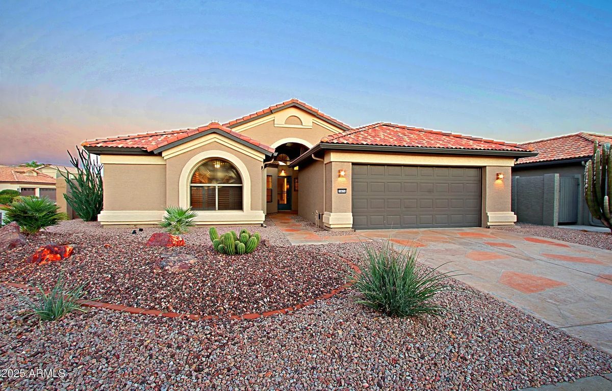 Street view of a flagged single-story home